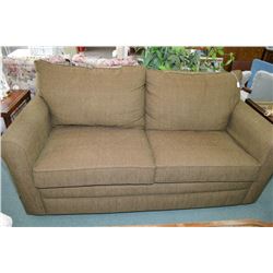 Hide-a-bed with green overstuffed upholstery- Rm 105