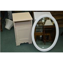 Two Small single door bathroom stand and white framed wall mirror