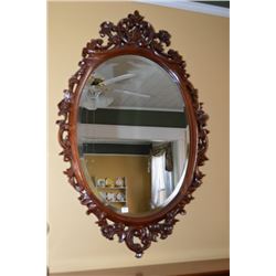 Victorian style carved framed bevelled wall mirror