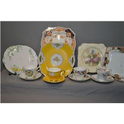 Selection of china cups and saucers, snack plates and small salt and pepper