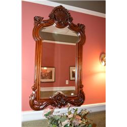Victorian style carved mahogany framed bevelled wall mirror. Overall dimensions 48" x 27"