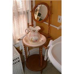 Victorian style washstand with ceramic washbowl and jug