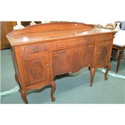 Antique mahogany sideboard with two drawers and fitted center with four doors on tall cabriole suppo