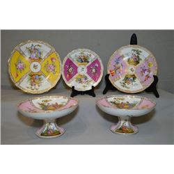 A pair of antique Dresden porcelain comports with love story panels, and three German porcelain plat