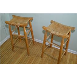 Two woven top wooden breakfast stools