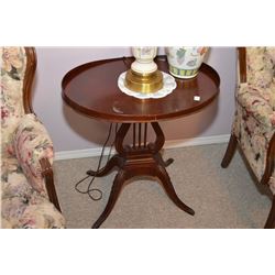 Mid 20th century mahogany parlour table with lyre pedestal and brass capped claw feet