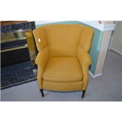 Vintage wing back chair full of stories