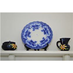 Two plates including antique flow blue plate and a hand painted floral motif cream and sugar