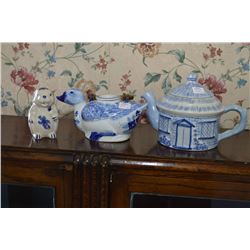 Cottage motif teapot, duck motif teapot and a rabbit motif creamer