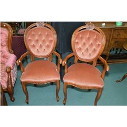 A pair of matching parlour chairs with button tufted upholstery