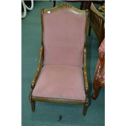 Pink velvet upholstered slipper chair with carved back