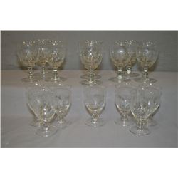 Selection of vintage cornflower crystal stemware including eight tall glasses and seven smaller glas