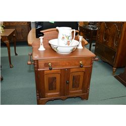 Mid century wooden washstand with double doors, scalloped back board, double towel rack and porcelai