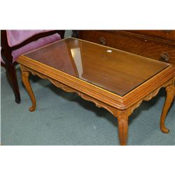 Mid 20th century coffee table with carved skirt and upper supports