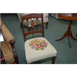 Antique delicately carved wooden side chair and floral needlework upholstered seat