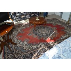 Red background area rug with large center medallion