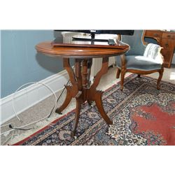 Antique Eastlake style occasional table with original porcelain castors