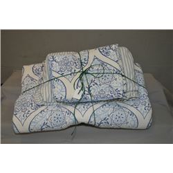 Selection of linens including bedspread, bed skirt and pillow shams