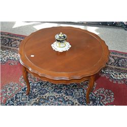 Small round walnut French provincial coffee table