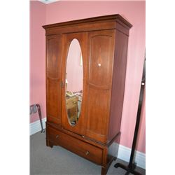 Single door antique wardrobe with oval bevelled mirror, inlaid decoration and storage drawer