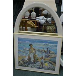 Oval framed mirror and a framed print family at the seaside