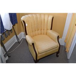 Antique brocade upholstered channel back parlour chair with carved show wood including ball and claw