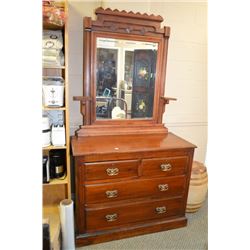 Eastlake four drawer mirrored dresser with original hardware, bevelled mirror and candle holders