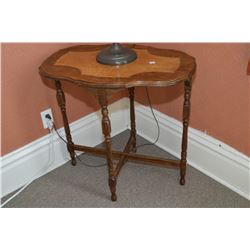 Mid 20th century occasional table with reeded supports and cross stretcher