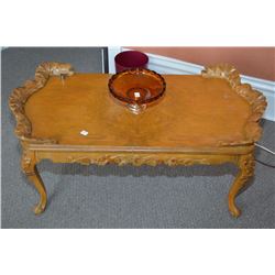 Antique matched grain coffee table with heavy carved decoration