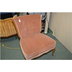 Wide pink velvet upholstered chair with cabriole supports