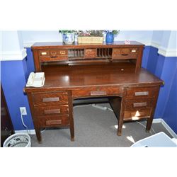 Antique quarter cut oak double pedestal desk with interesting topper with stationary drawers, cubby 