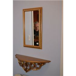Gilt framed wall mirror and wall sconce