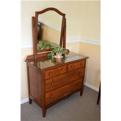 Antique four drawer mirrored dresser with original finish and original wooden pulls