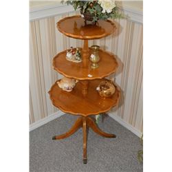 Mid 20th century three tier mahogany centre pedestal butler with brass capped claw feet