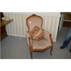 Victorian style upholstered parlour chair with carved show wood