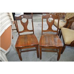 A pair of wooden side chairs