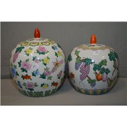 Two lidded hand painted Oriental urns