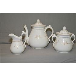 Antique teapot, cream and sugar from Bridgwood & Son, note damage to spout