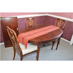Semi contemporary oval dining table with insert leaf and six mismatched upholstered seat dining chai