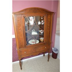 Antique single door walnut china cabinet with single storage drawer