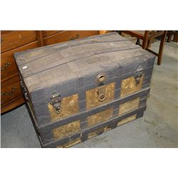 Antique dome topped steamer trunk with wooden binding and fitted shelf