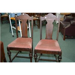 Two pink velvet upholstered wooden dining chairs