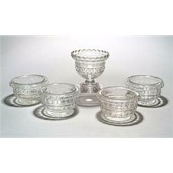 A selection of cut glass, comprising: a pedestal bowl, of ogee form with cerrated rim and cut wit...