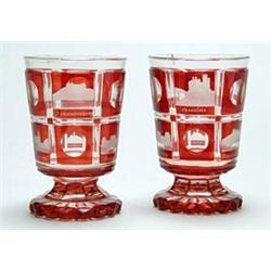 A pair of Bohemian ruby-flash spa goblets, the bucket bowls cut with square panels engraved with...