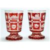 Image 1 : A pair of Bohemian ruby-flash spa goblets, the bucket bowls cut with square panels engraved with...