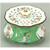 Image 1 : A Meissen green-ground lobed circular pounce-pot, painted in a Kakiemon style with japanesque pan...