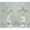 Image 1 : A pair of Sitzendorf flower-encrusted figural four-branch candelabra, each stem modelled as a cla...