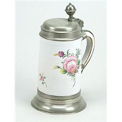 A German fayence (Proskau, Silesia) pewter-mounted tankard and hinged cover, painted in coloured...