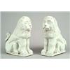 Image 1 : A pair of German fayence models of lions, seated on their haunches and painted with a white glaze...