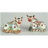 Image 1 : A pair of Delft polychrome models of recumbent horned cows, facing left and right, painted with s...